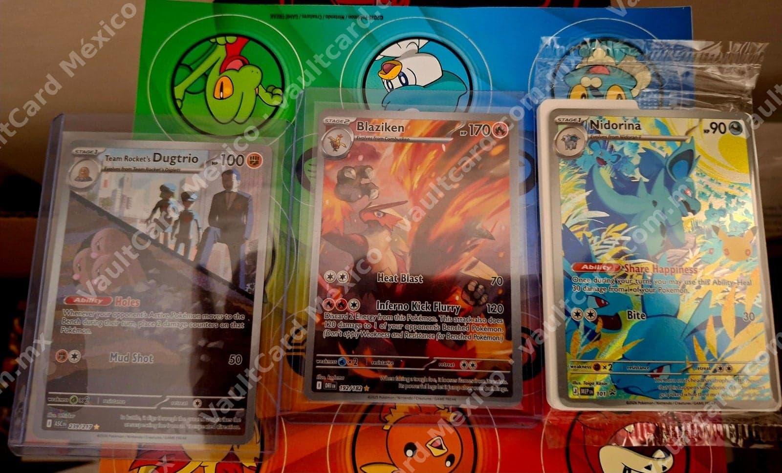 Lote 3 Cartas Pokémon Inglés - Blaziken 192/182 (DRI), Team Rocket's Dugtrio 239/217 (ASC) y Nidorina 101 (MEP)
