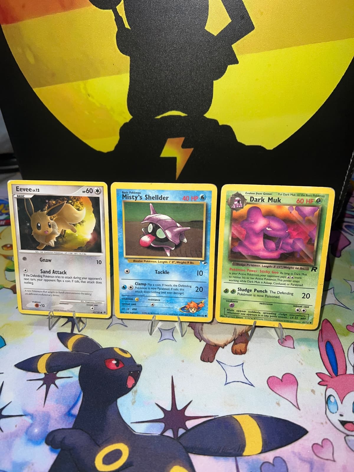 Lote 3 Cartas Pokémon - Eevee, Misty's Shellder y Dark Muk - Inglés